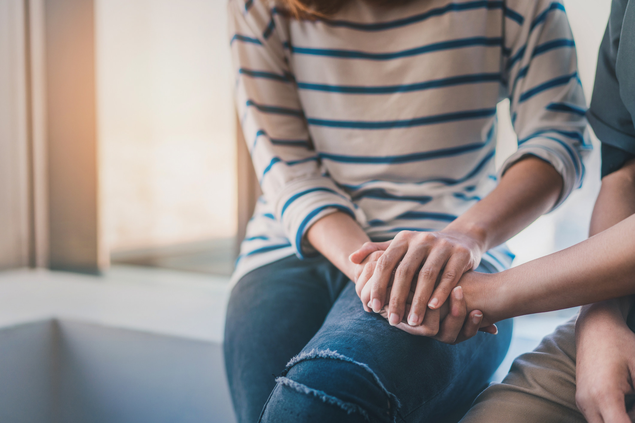 Two people clasping hands