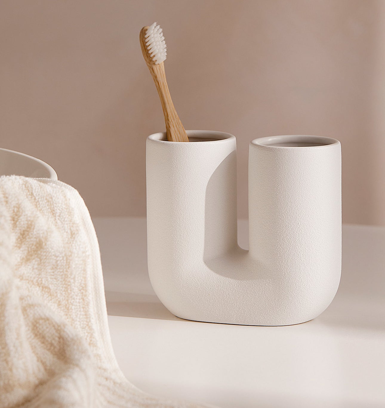 The toothbrush holder with a toothbrush inside