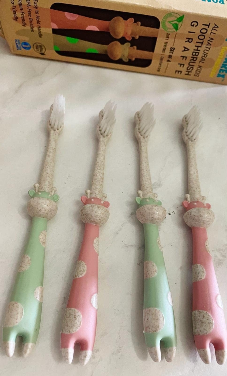 A user photo of the mint and pink toothbrushes