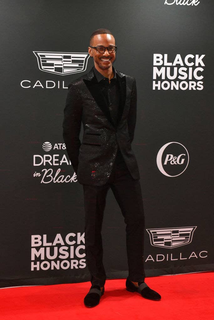 Tevin posing on a red carpet and smiling