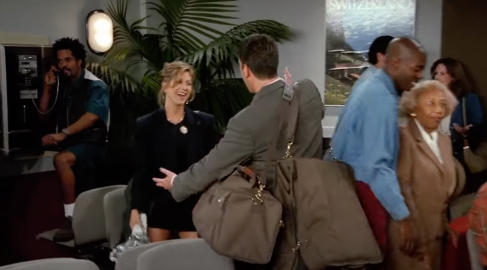 Ross and Rachel hugging at the airport on Friends