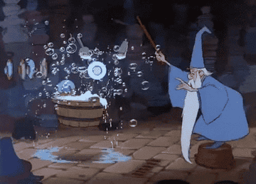 a gif of Merlin in the movie &quot;The Sword in the Stone&quot; waving a wand to clean dishes