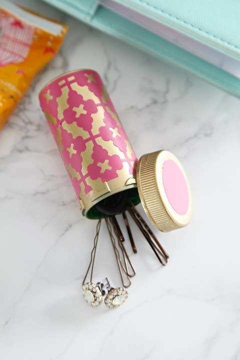 bobby pins in a decorated pill bottle