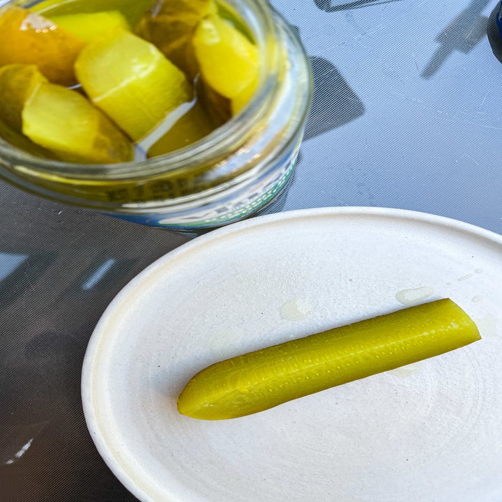 pickle spear on a plate. 