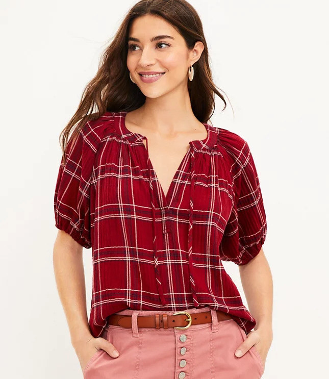 model wearing a red plaid puff sleeve top