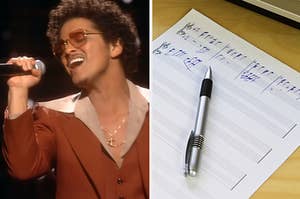 A close up of Bruno Mars as he sings into a microphone and sheet music