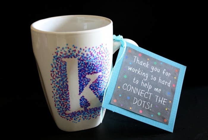 mug decorated with dots in the shape of a letter