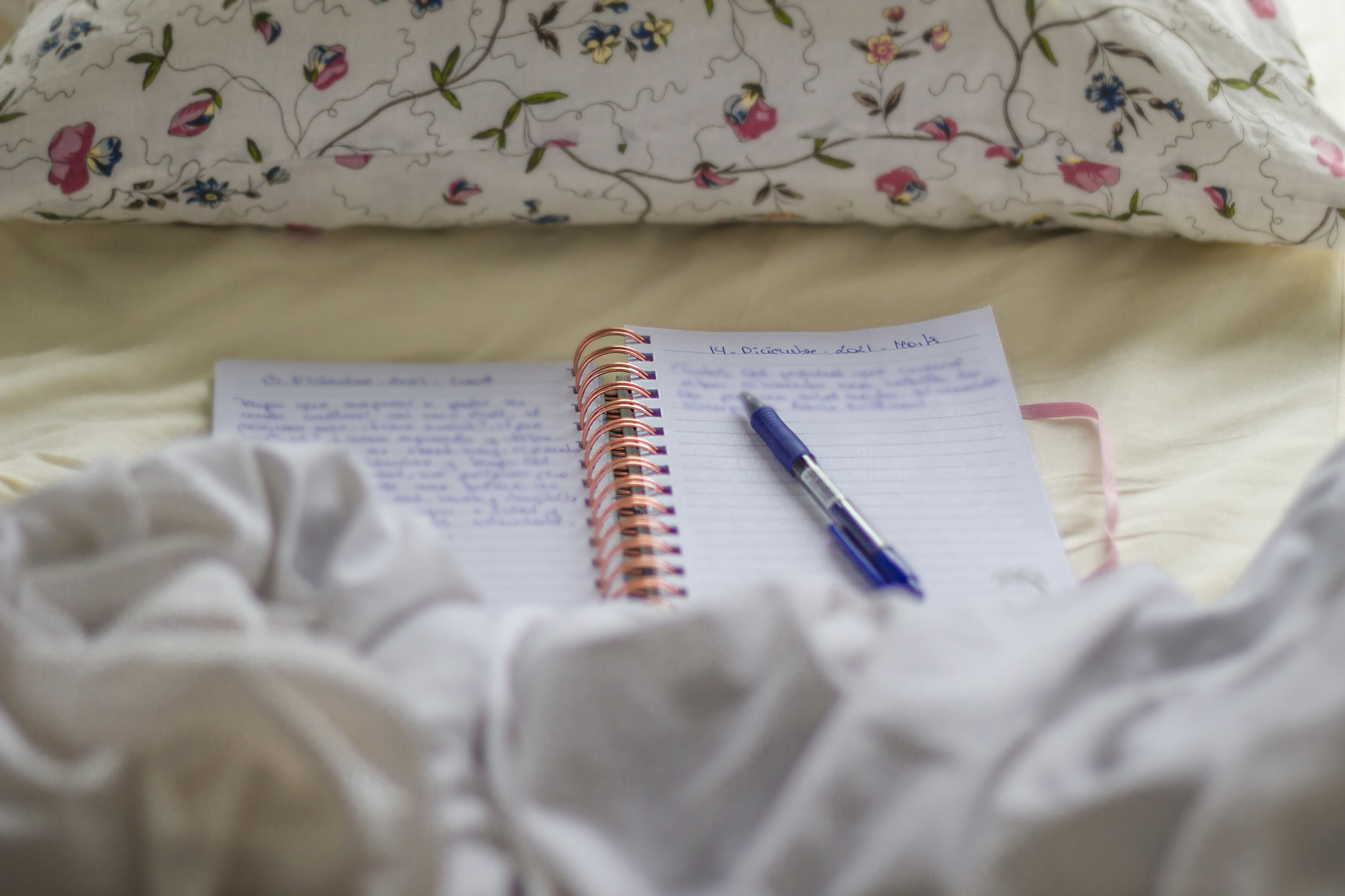an open journal on a bed