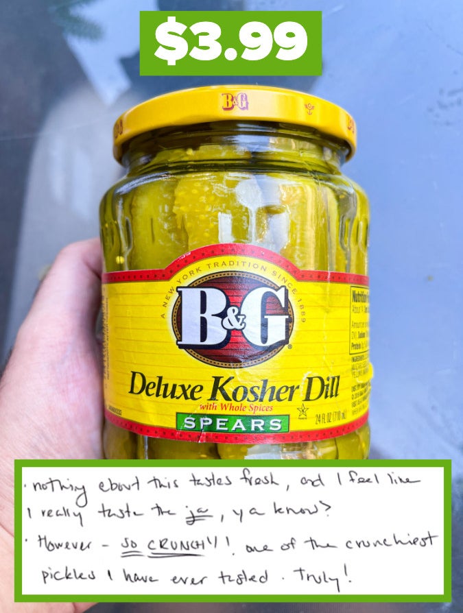 Hand holding a jar of B&amp;amp;G Deluxe Kosher Dill pickles with a price tag, annotated with positive review notes