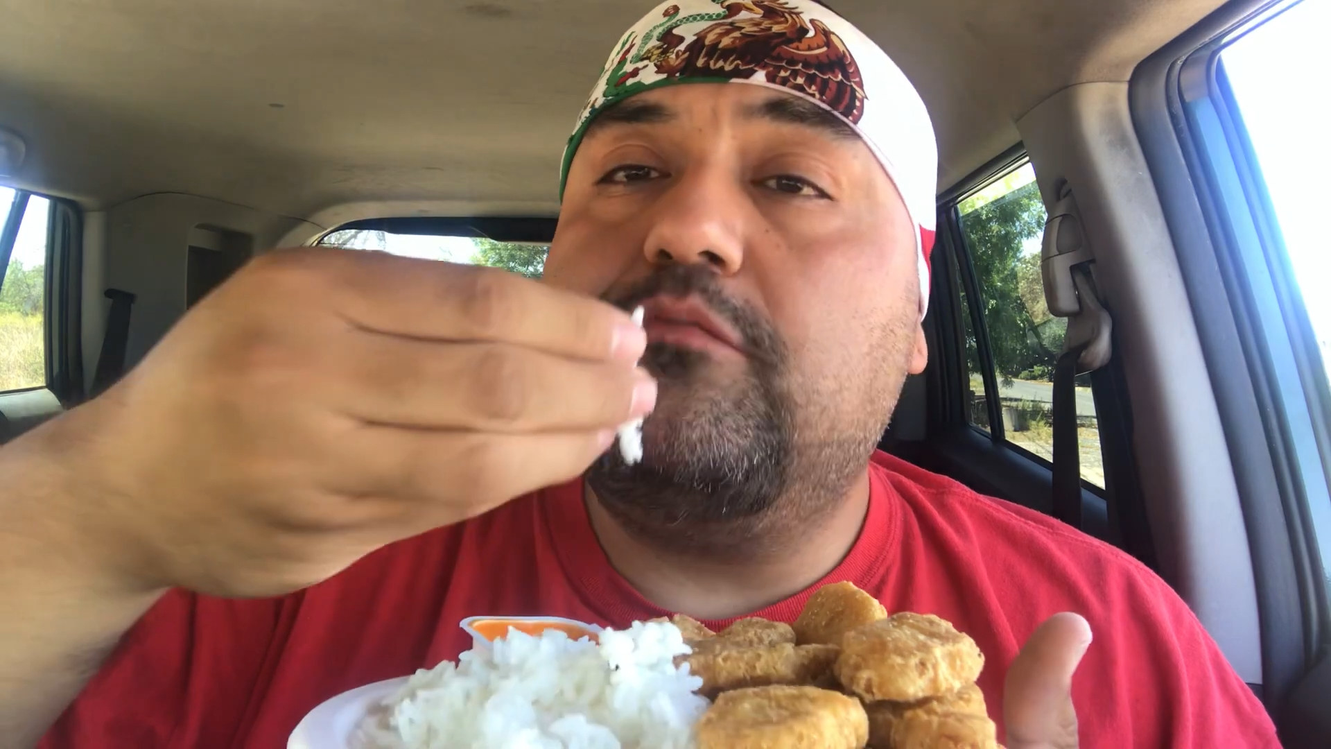 eating chicken nuggets with rice