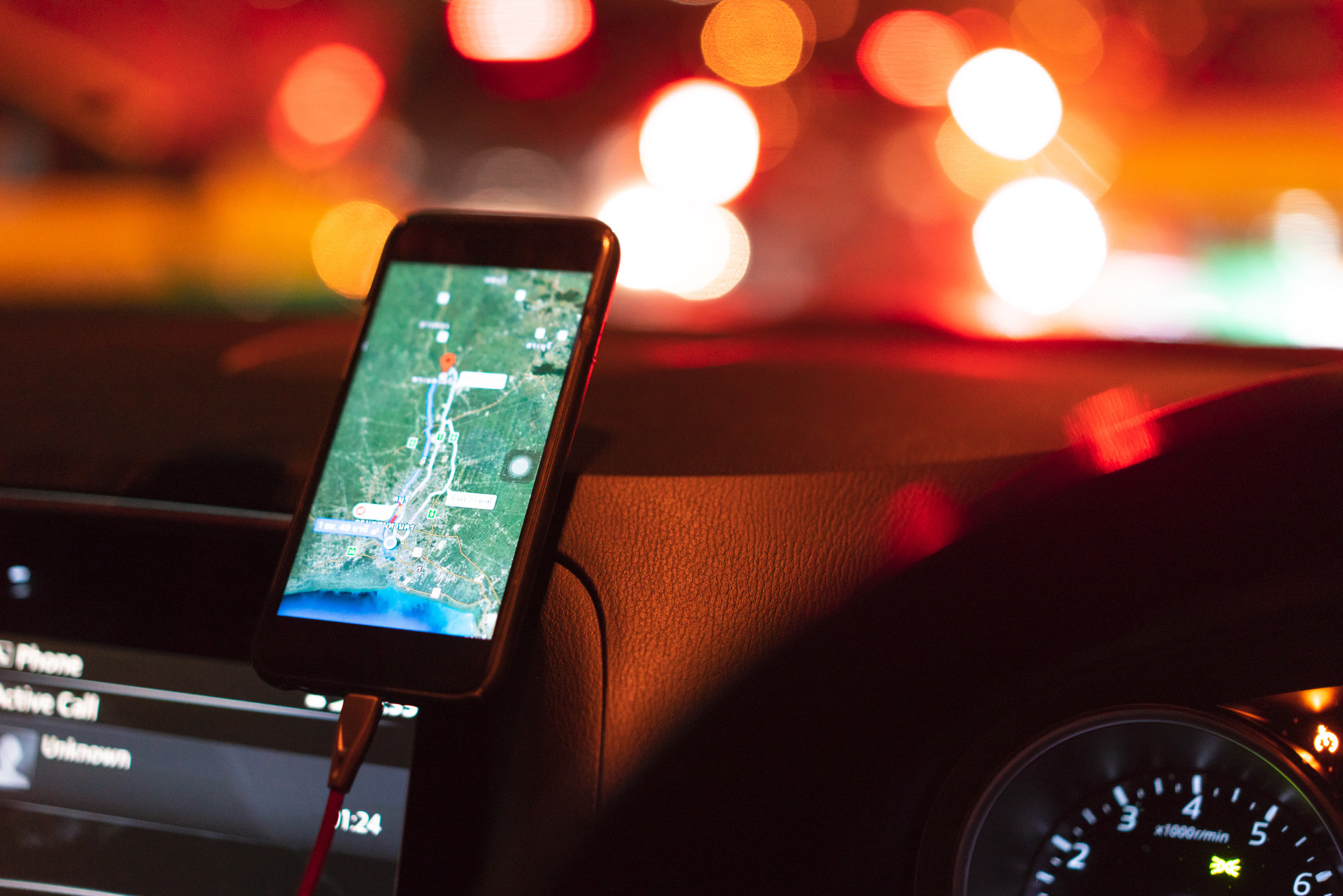 A phone map with directions in a car.
