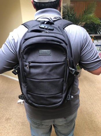 Reviewer wearing backpack