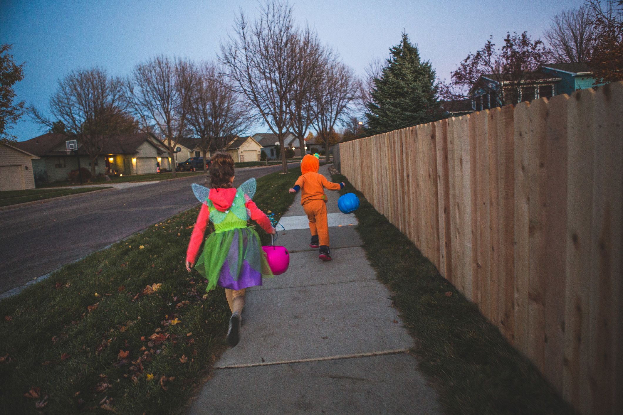 Kids in costumes trick or treating.