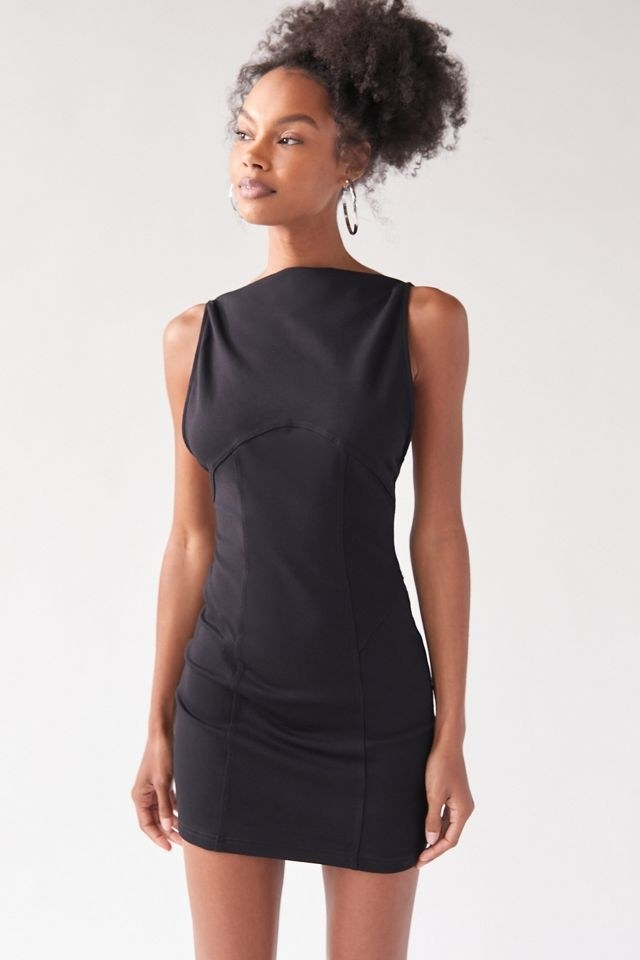 model wearing the black mini dress