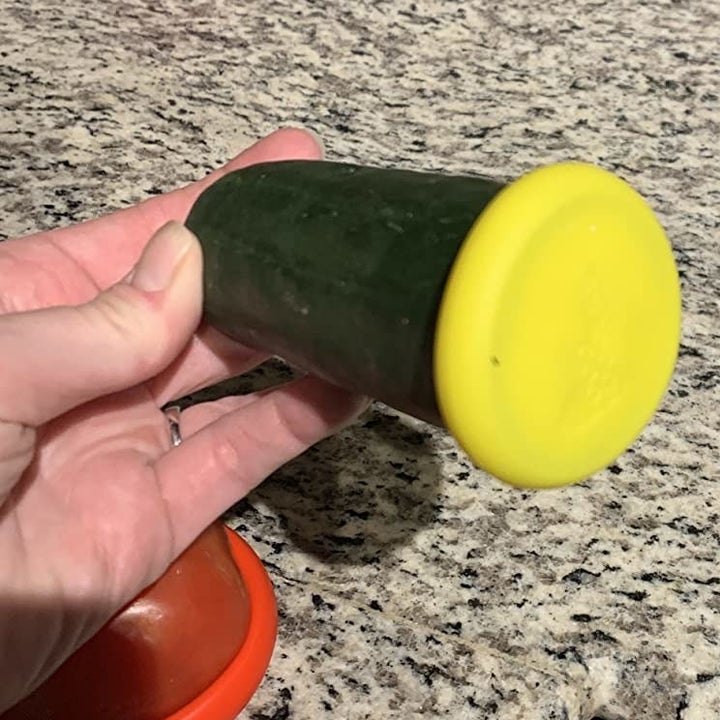 a reviewer photo showing the food hugger on a cucumber