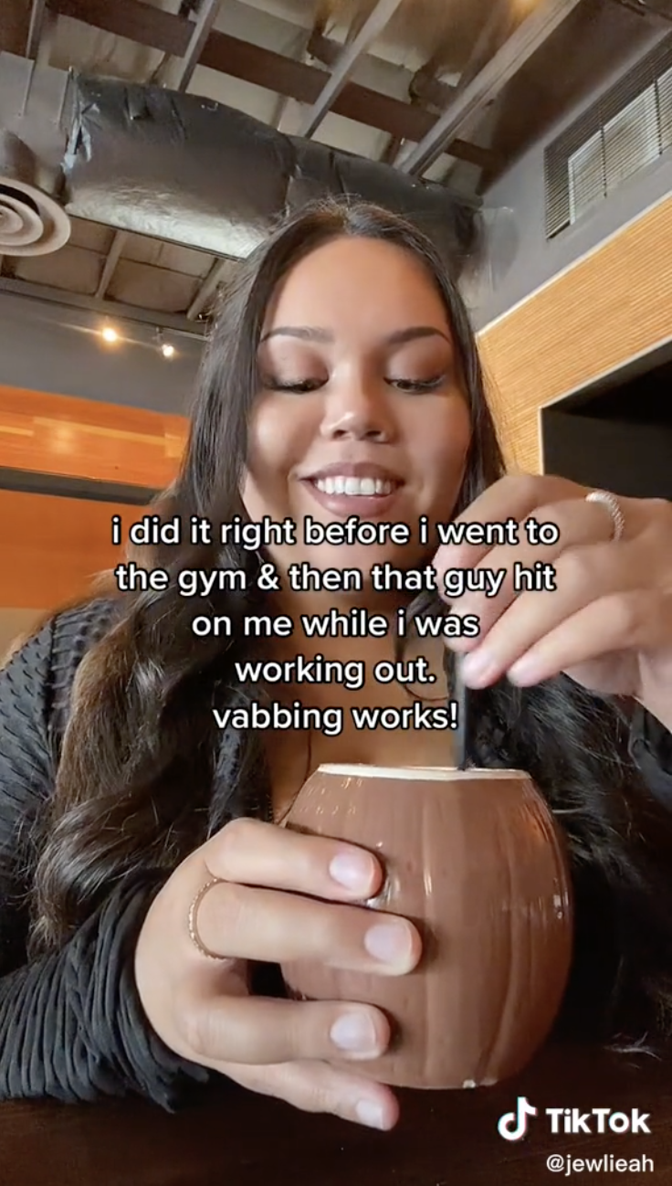 Julia stirs a mug with the caption, &quot;i did it right before the gym &amp;amp; then that guy hit on me while I was working out; vabbing works!&quot;