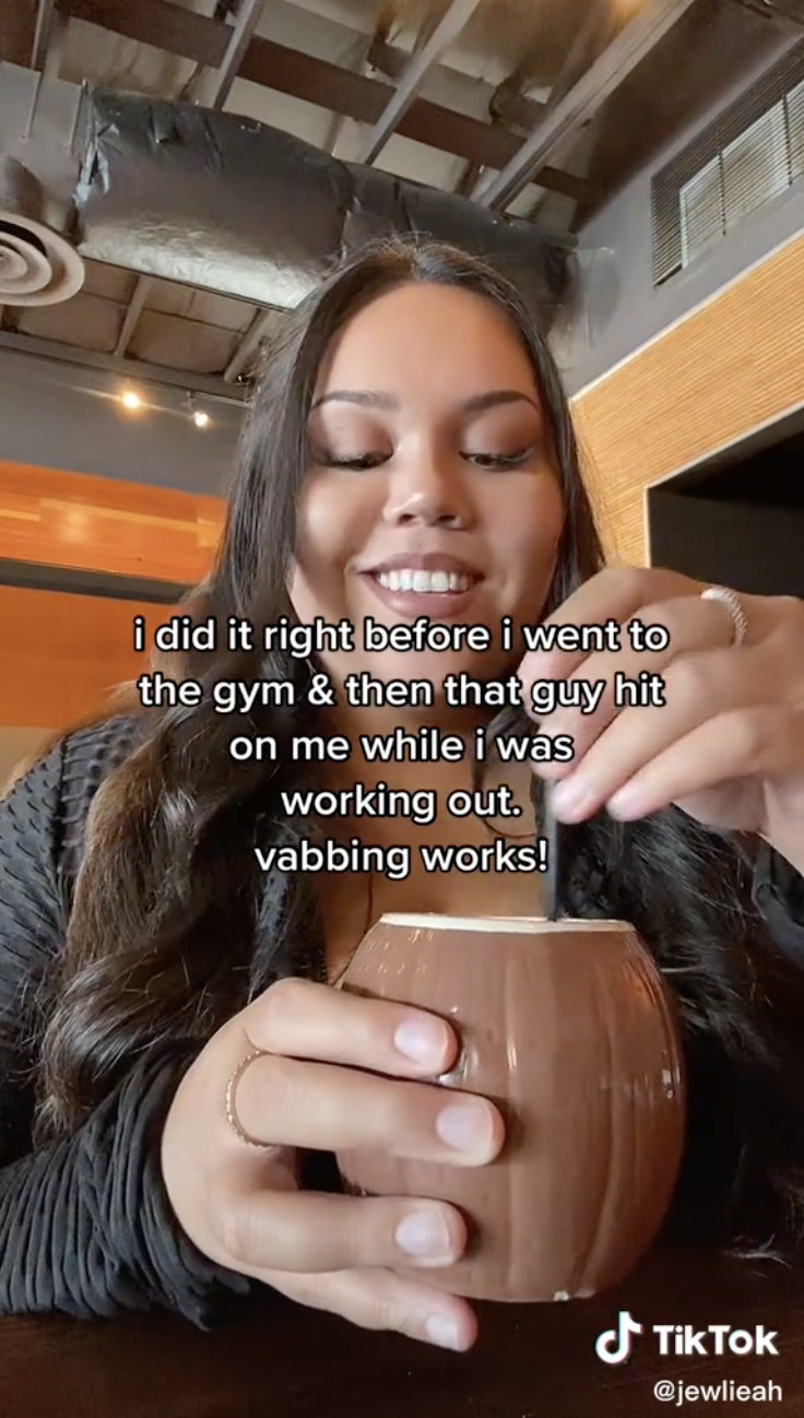 Julia stirs a mug with the caption, "i did it right before the gym & then that guy hit on me while I was working out; vabbing works!"