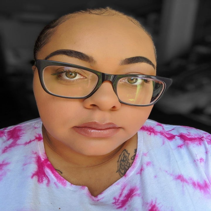 reviewer with face full of makeup after using the primer