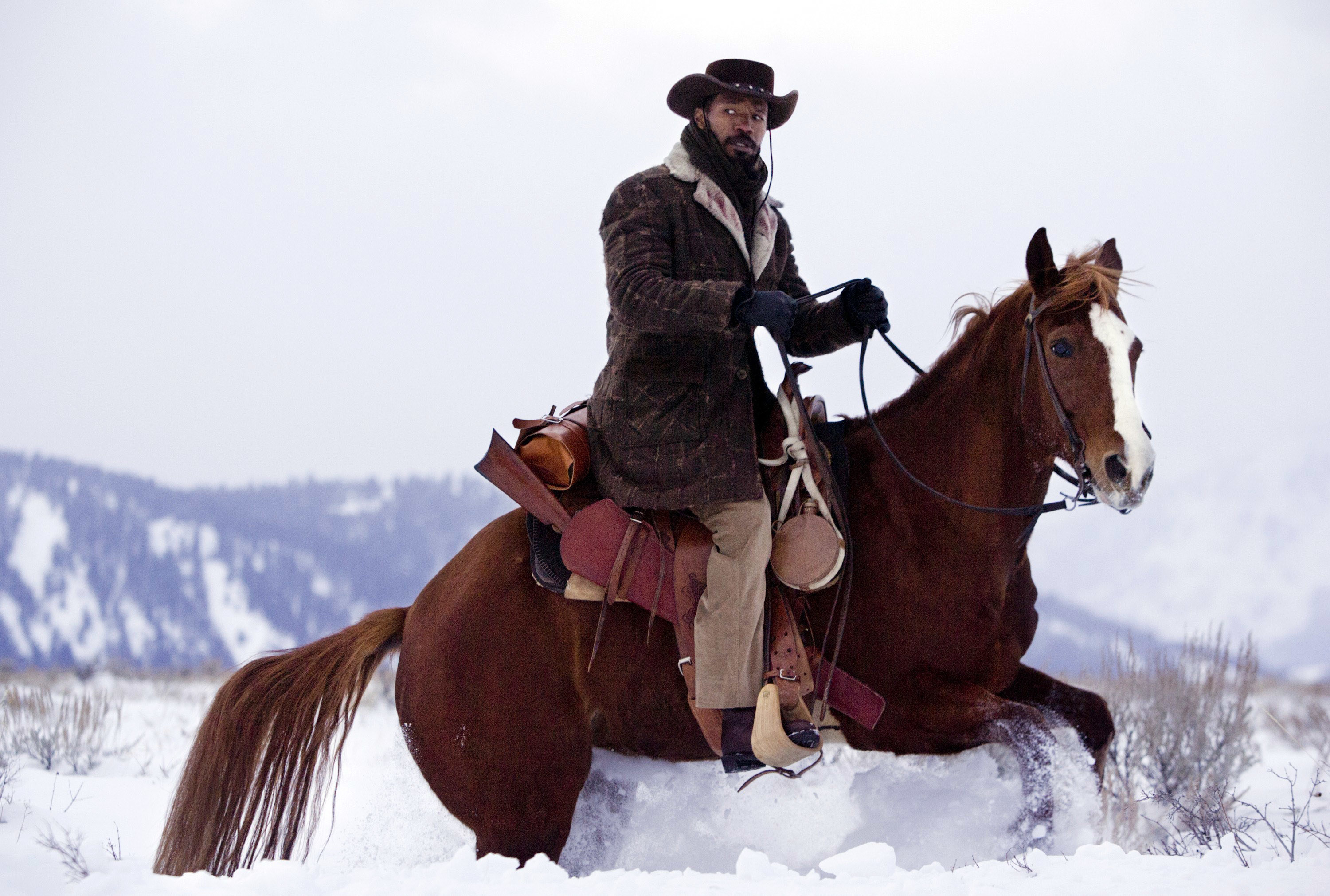 Jamie Foxx rides a horse through the snow in &quot;Django Unchained&quot;