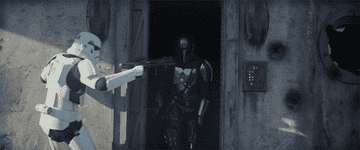 The Mandalorian fights his way out of a building