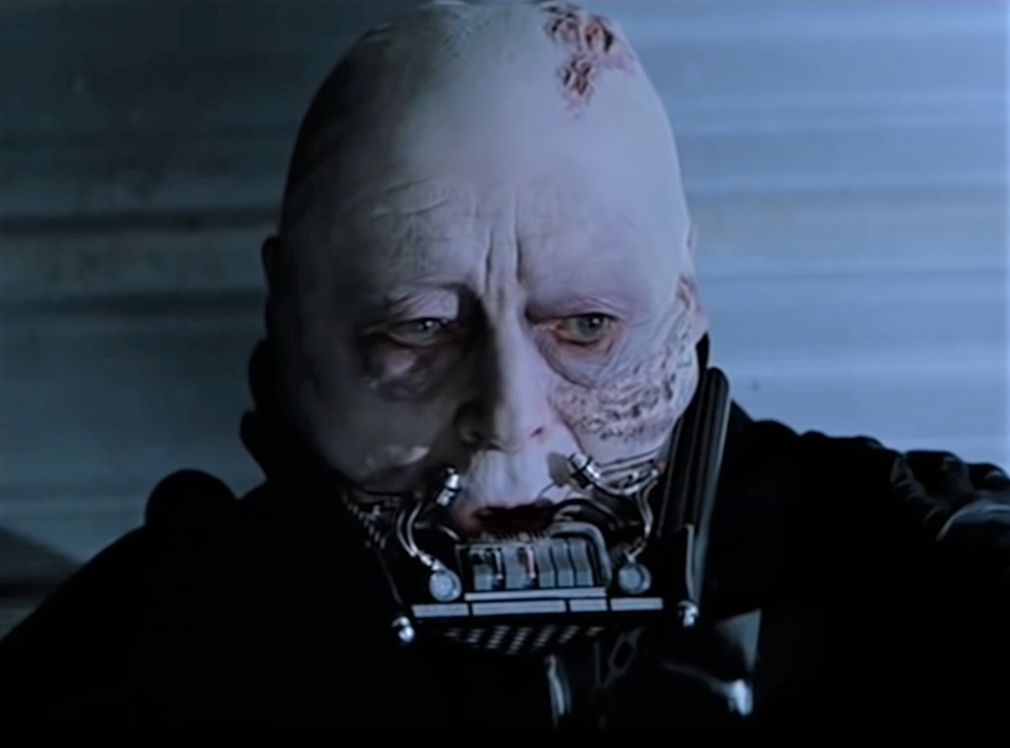 Darth Vader&#x27;s helmet is removed, revealing his scarred face