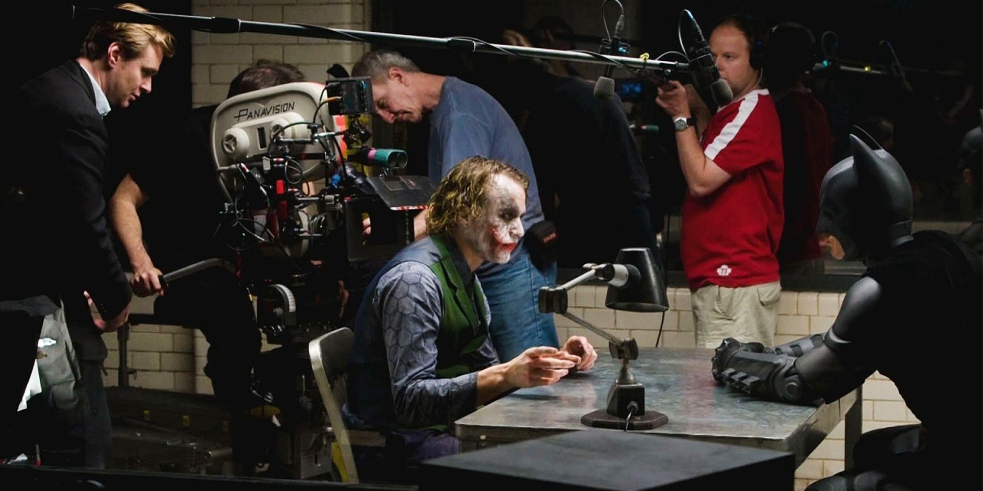 director Christopher Nolan; foreground from left: Heath Ledger as Joker, Christian Bale as Batman