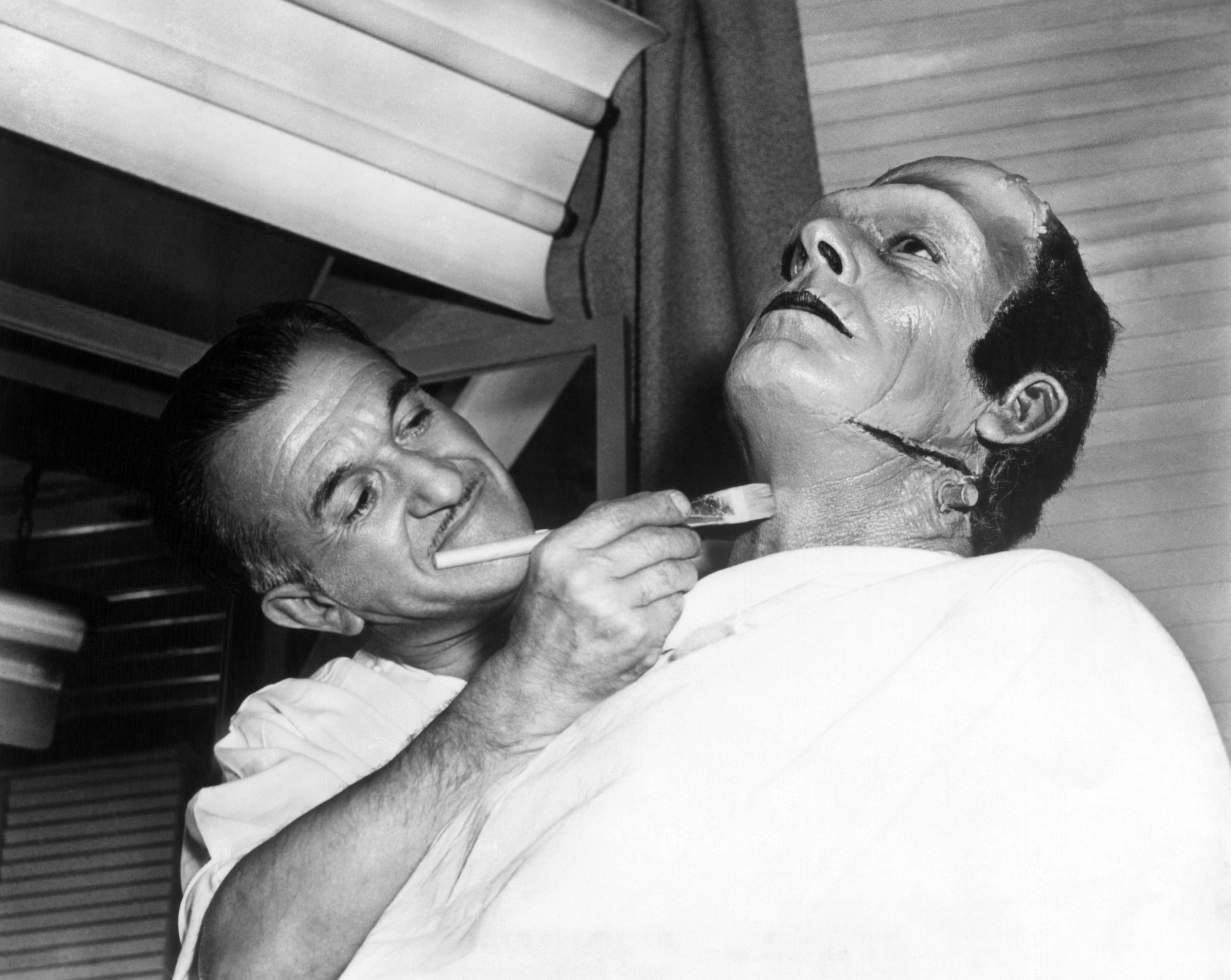 makeup artist Jack P. Pierce turning Glenn Strange into the &#x27;Frankenstein monster&#x27;