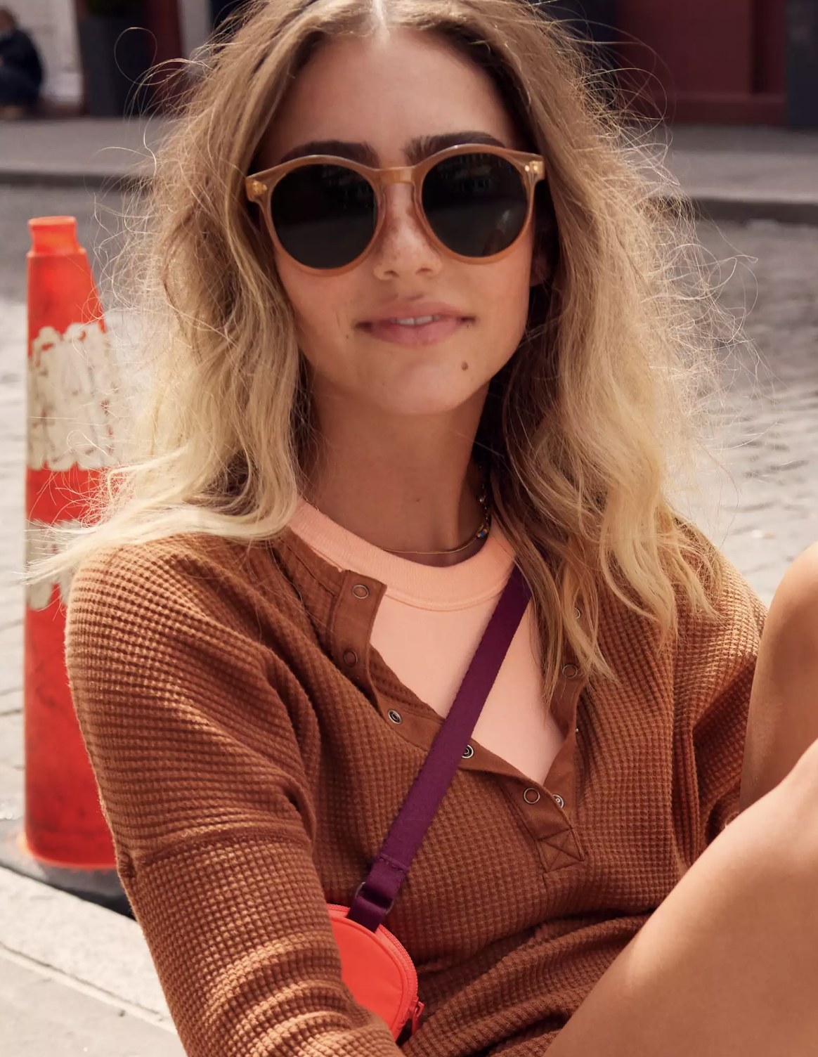 Model wearing the tan sunglasses