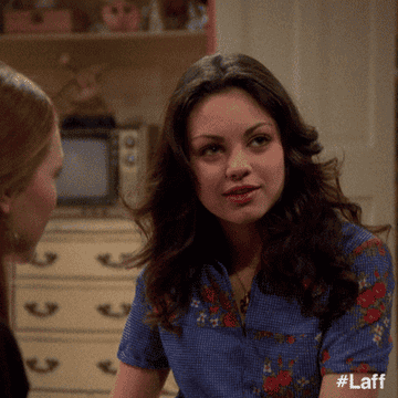 Mila Kunis from That 70s Show daydreaming