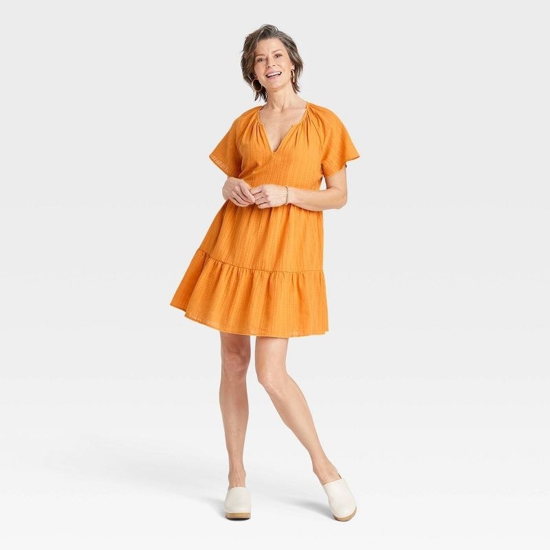 front view of the dress in orange