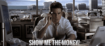 Actor Tom Cruise mouthes &quot;show me the money&quot; into a cellphone
