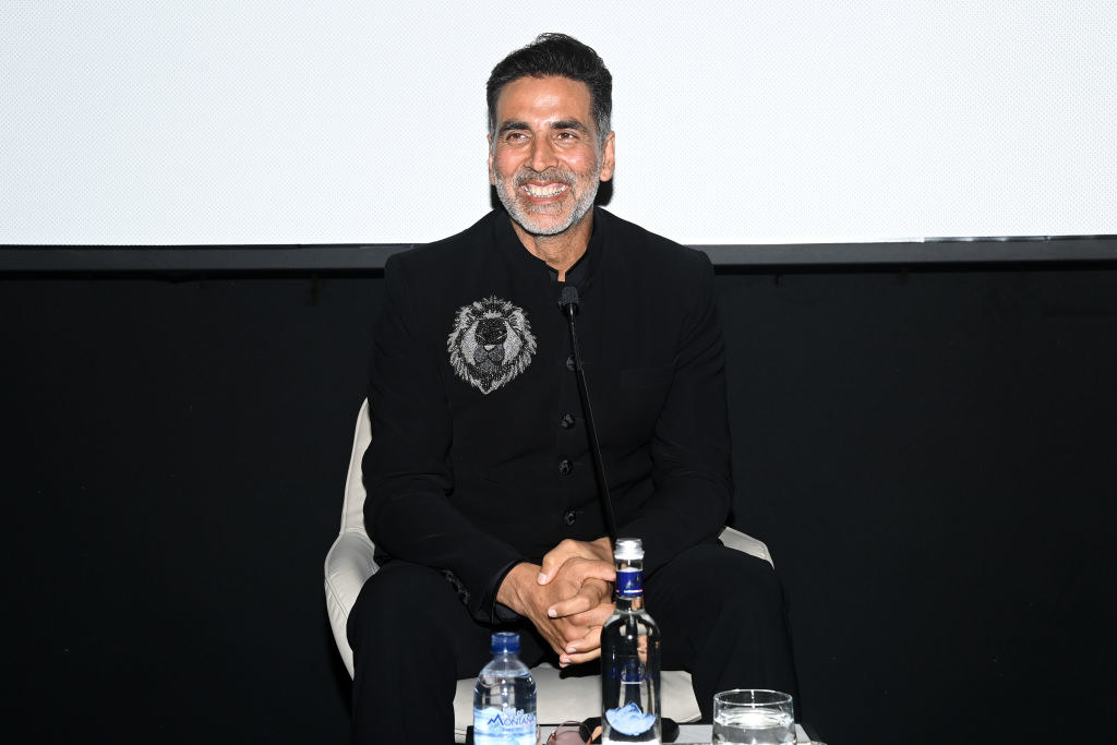 Akshay Kumar smiles with his hands folded