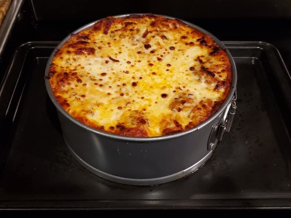 Reviewer&#x27;s photo of lasagna sitting on stove in springform pan