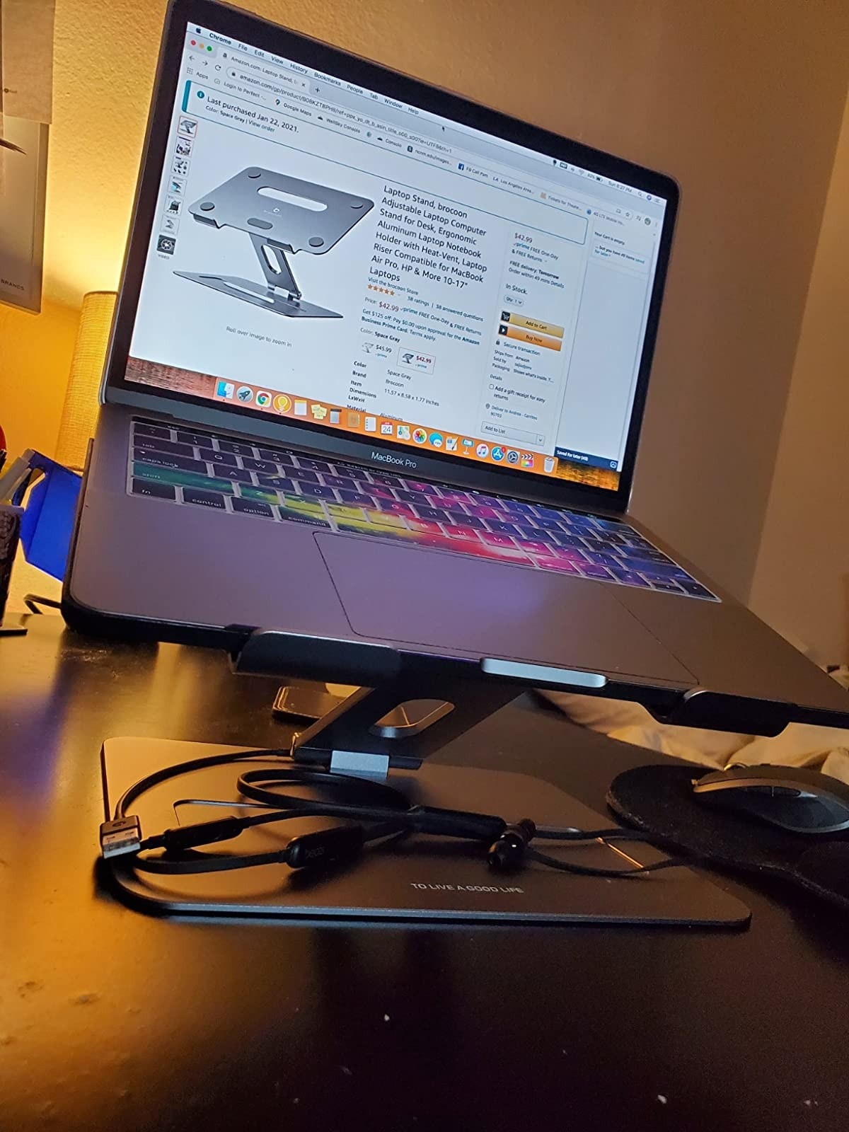Reviewer&#x27;s photo of the stand supporting their laptop