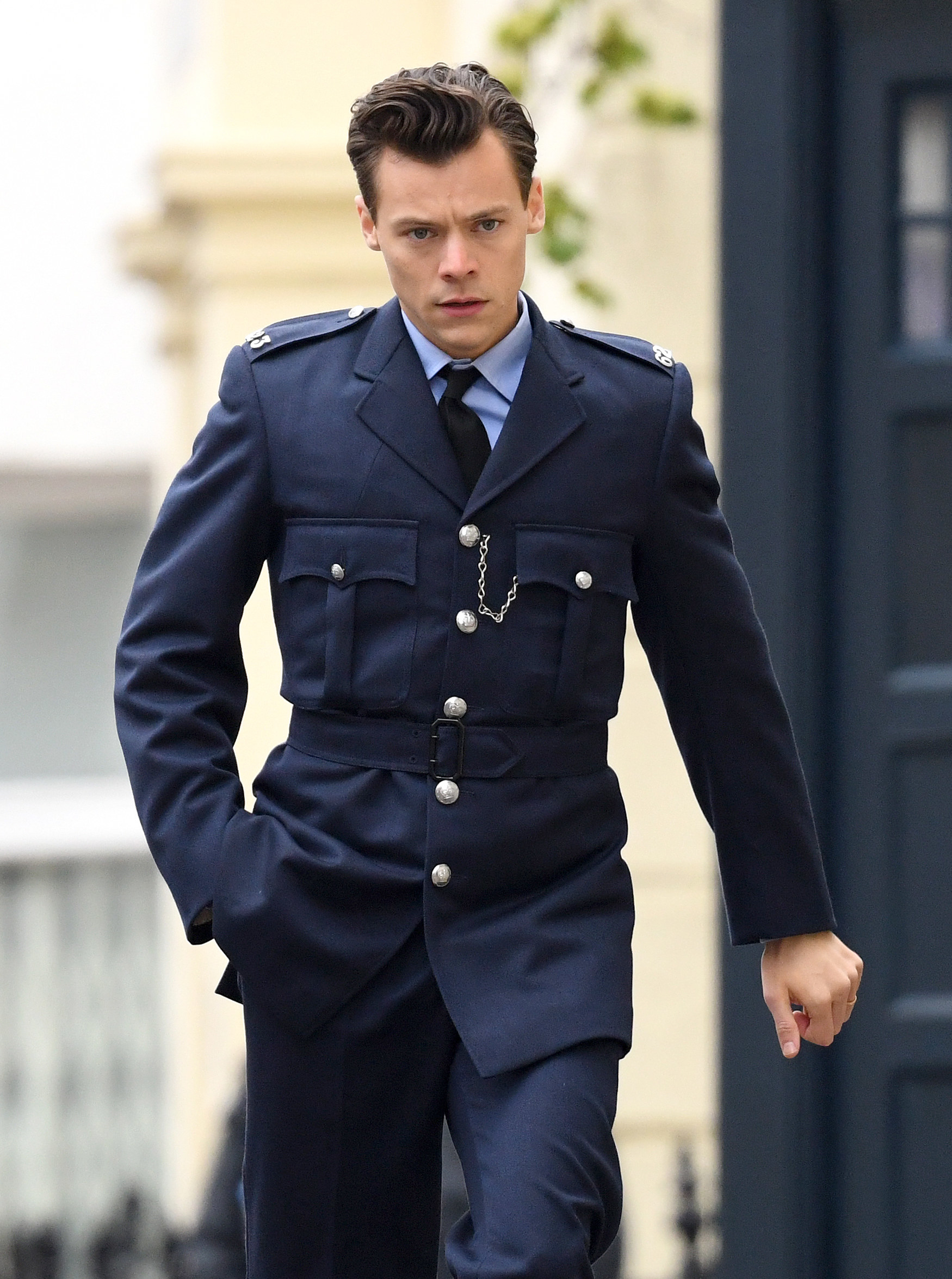 Harry in uniform walking down the street
