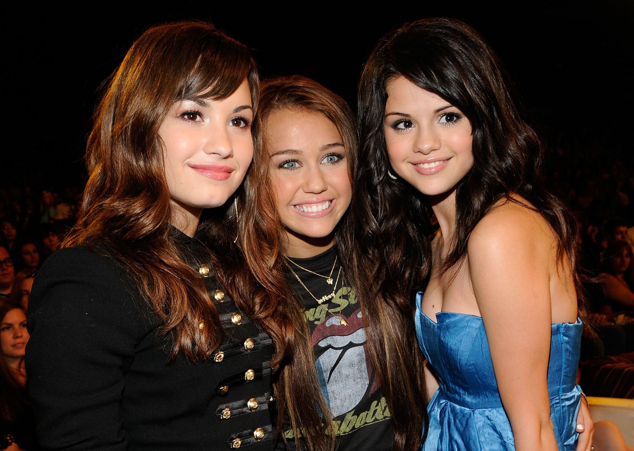 Demi poses with Miley Cyrus and Selena Gomez as a teen