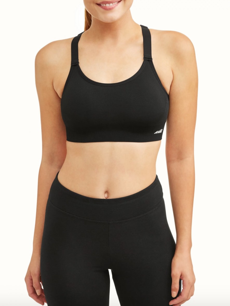 Model wearing black sports bra with black leggings