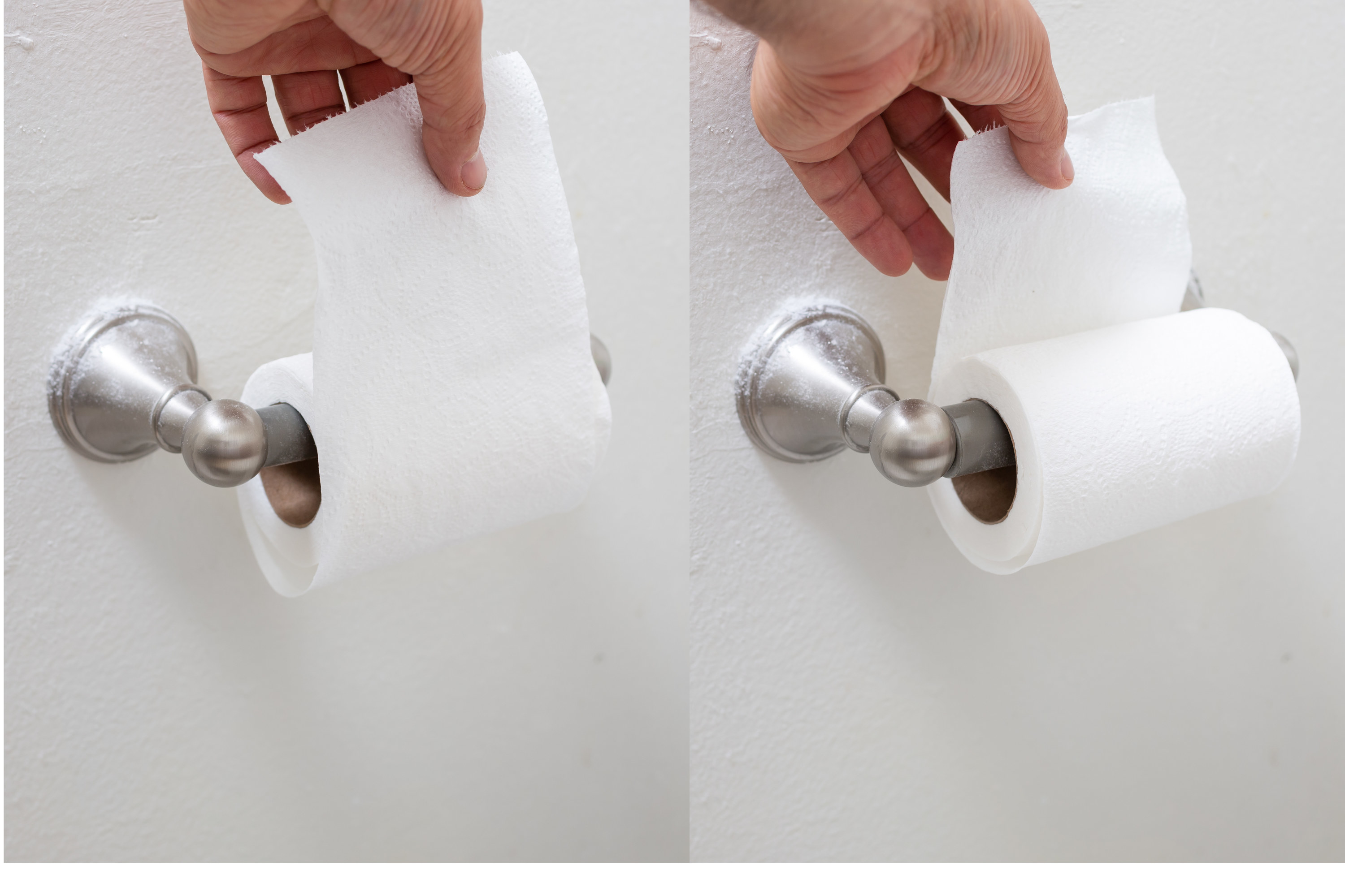 A toilet roll being pulled from the top and another from the bottom