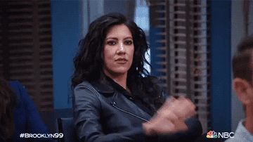 detectives amy and rosa high-fiving from a scene in brooklyn 99
