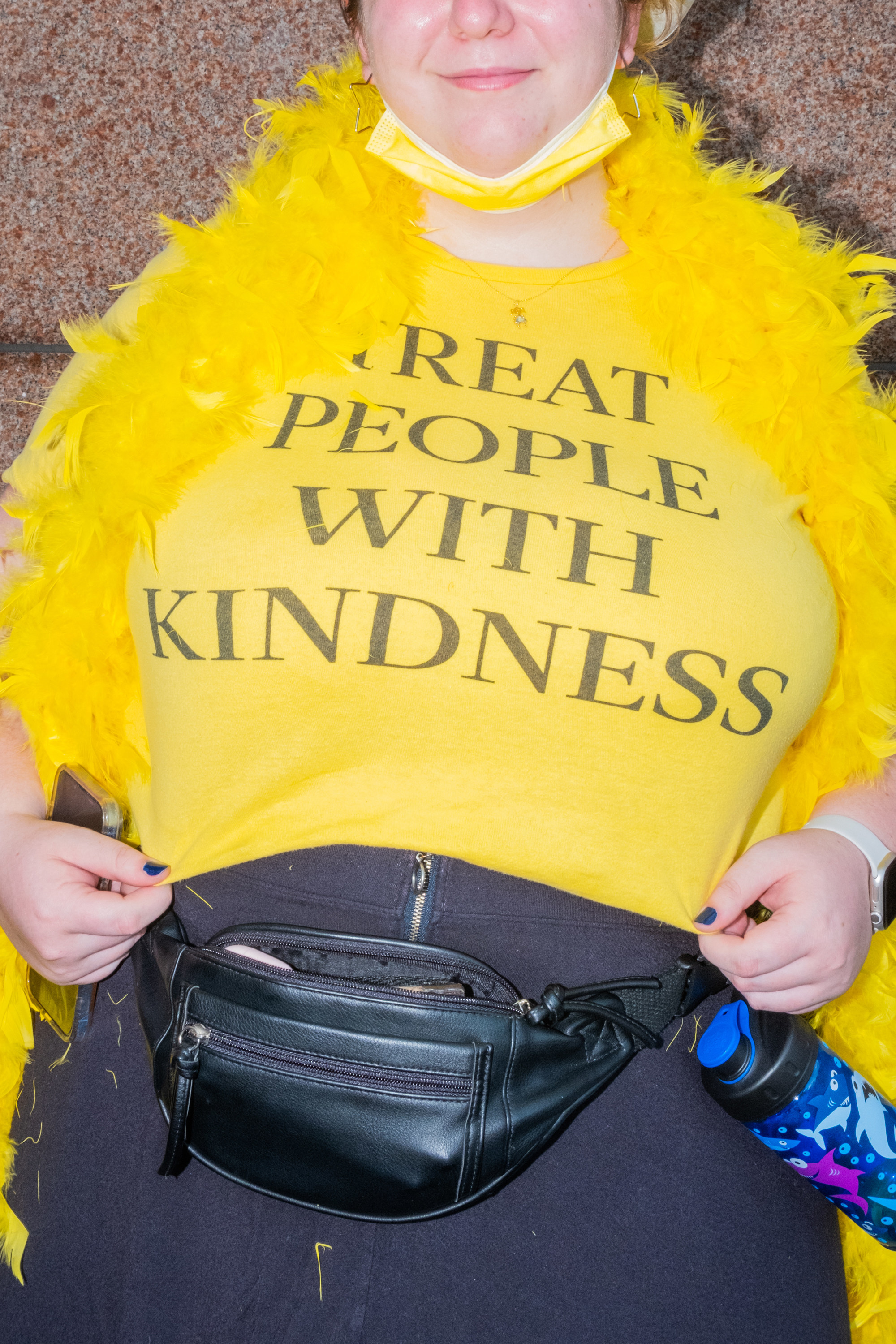 A woman wears a shirt that reads &quot;Treat People With Kindness&quot;