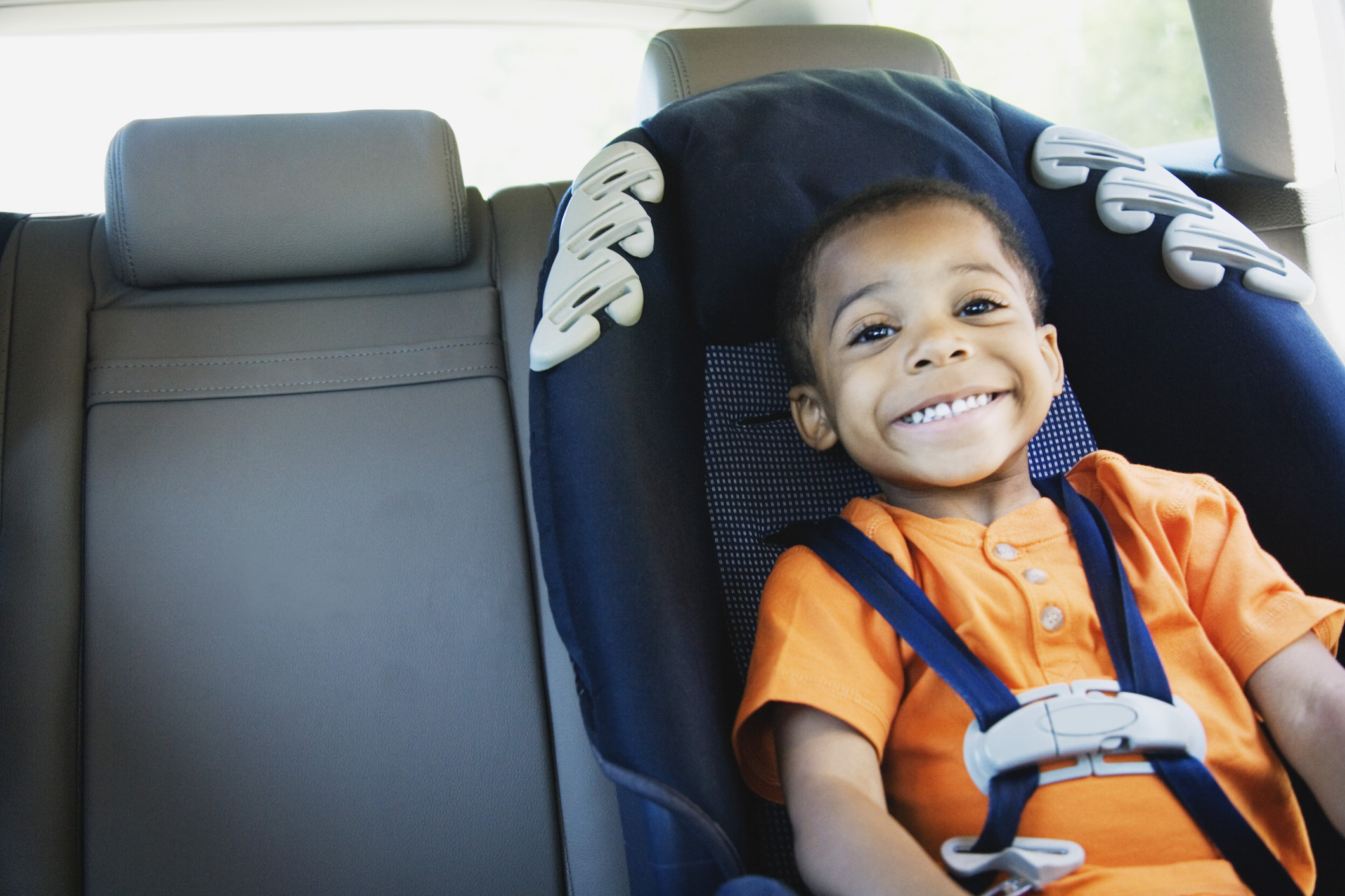 a child in a car seat