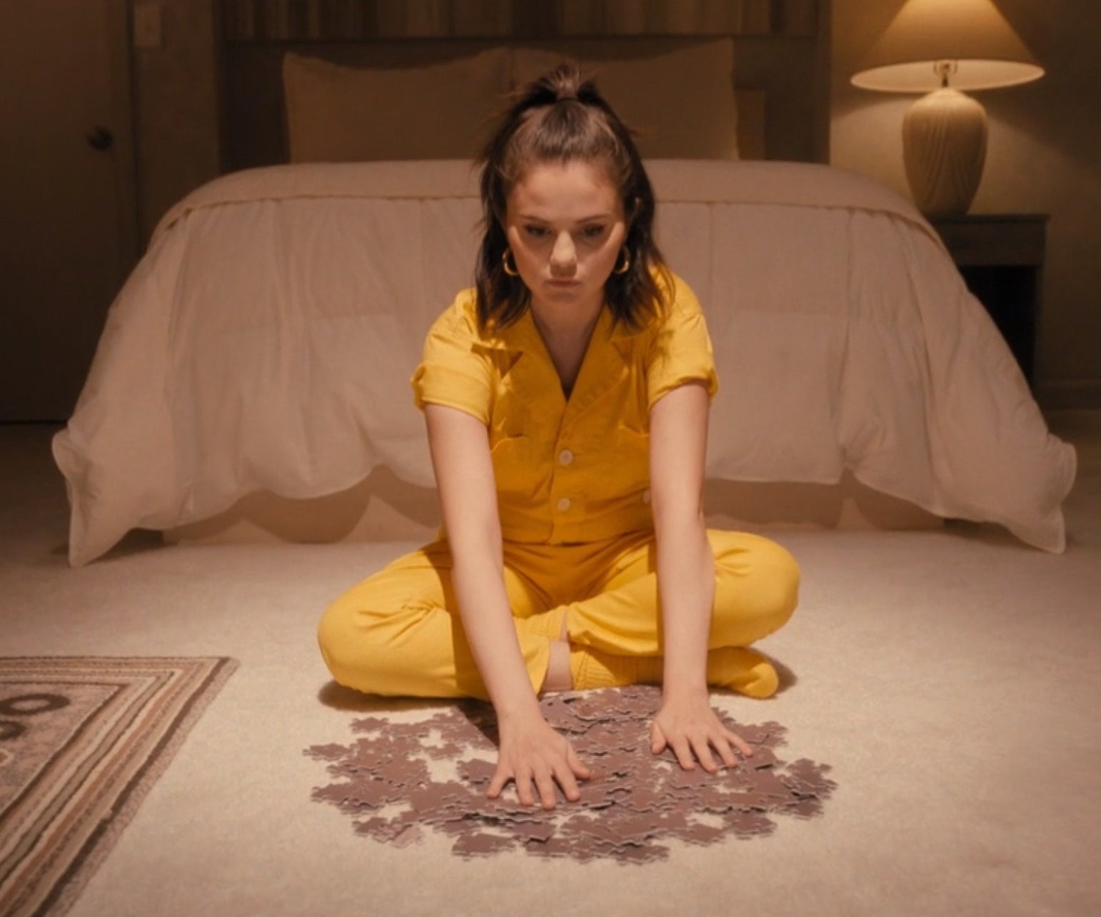Mabel sitting on her bedroom floor with puzzle pieces