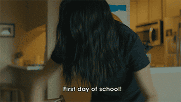person cheering and saying first day of school