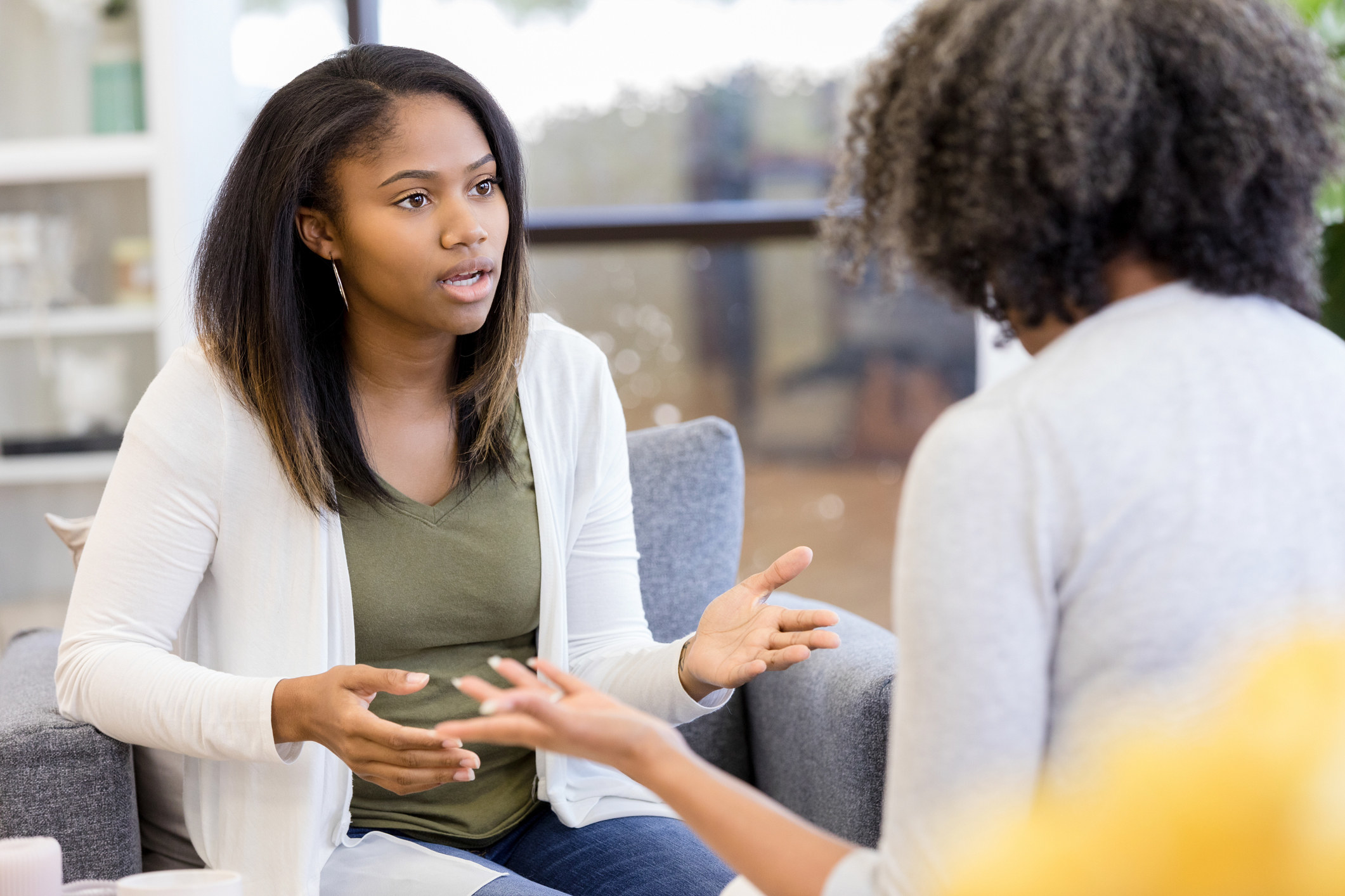 A young girl talking to her mom