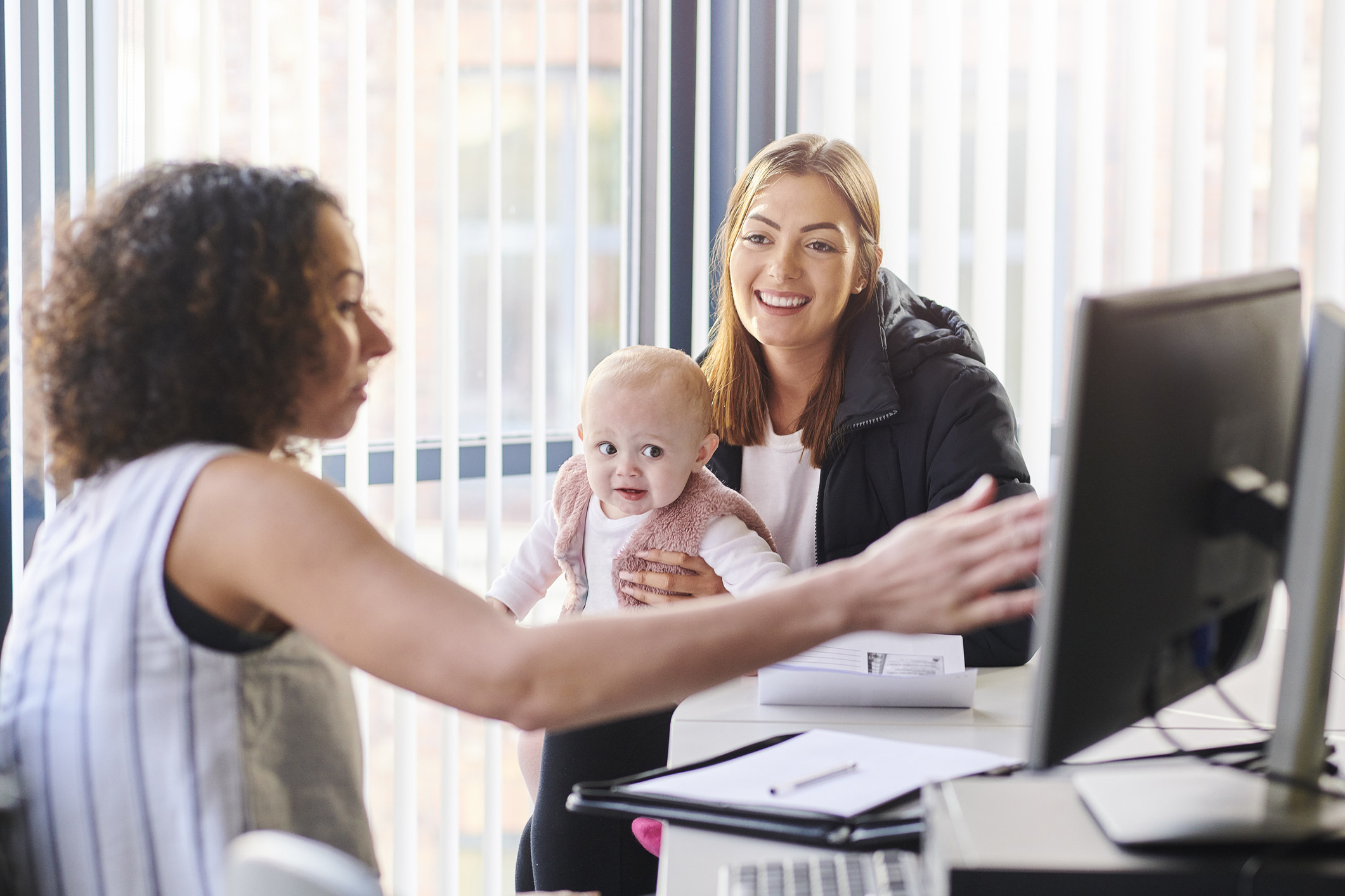 An office worker with a young mother