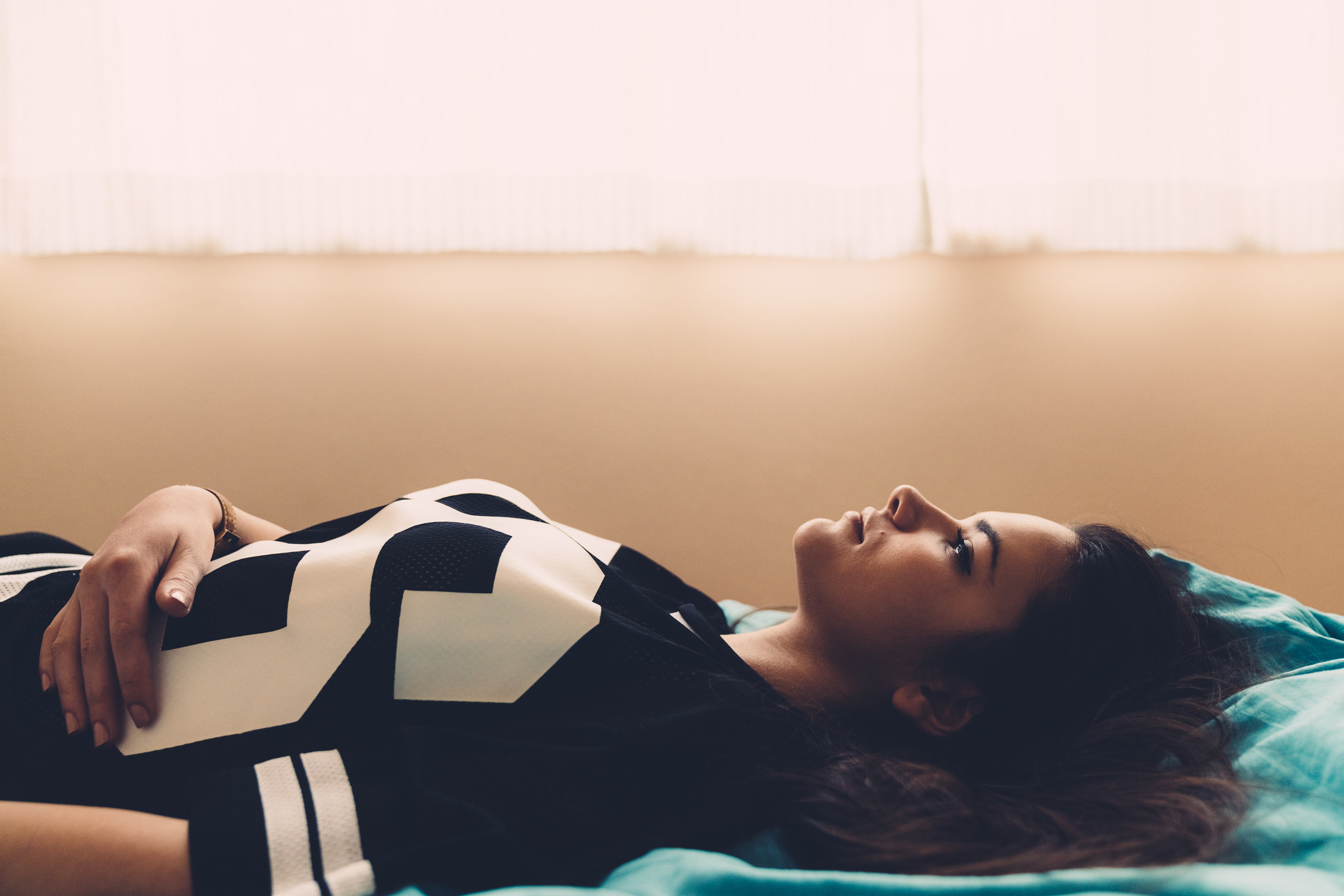 A young woman laying in bed