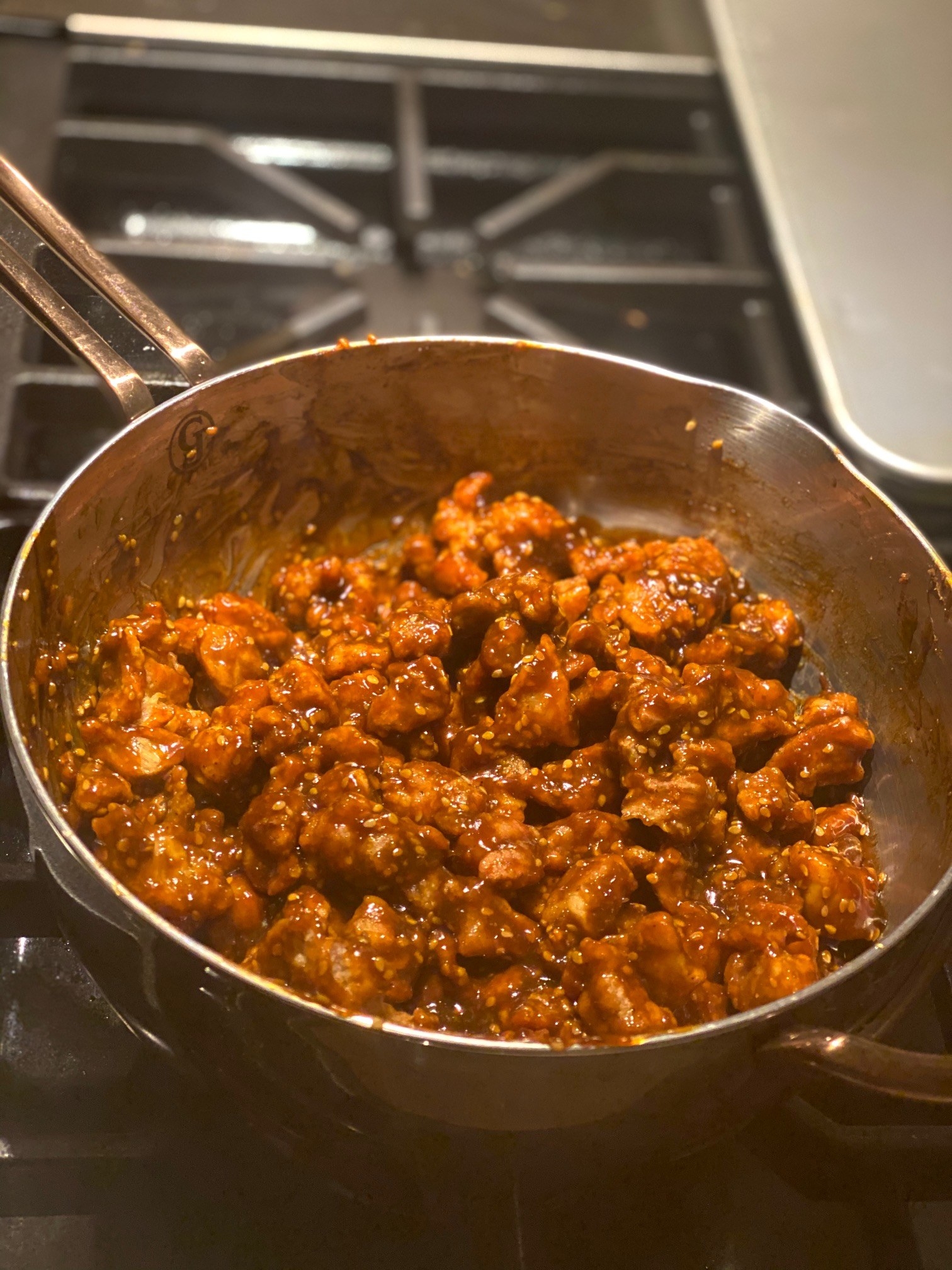 Chicken cooking in a skillet.