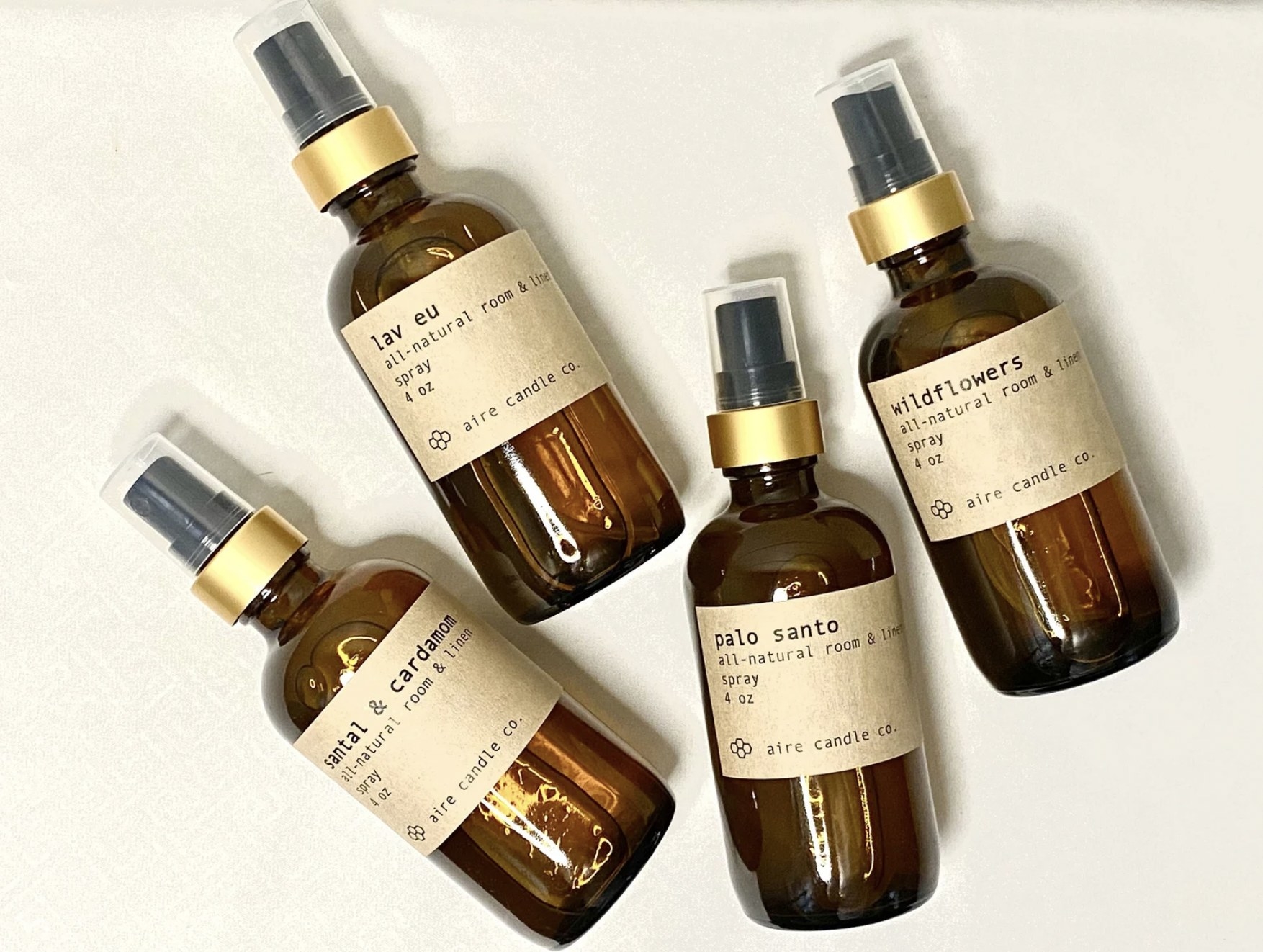 Four of the pillow mists in scents lave eu, palo santo, wildflowers, and santal &amp;amp; cardamon