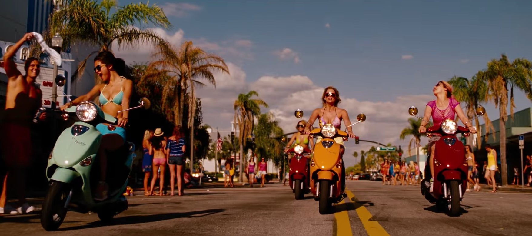 Candy, Faith, Brit, and Cotty reading motorbikes down a street in &quot;Spring Breakers&quot;