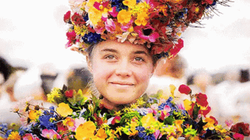 A woman in a flower crown smiling